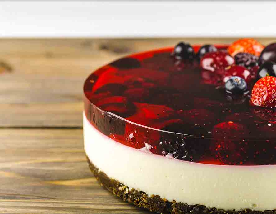 Cheesecake topped with Rote Gruetze. 