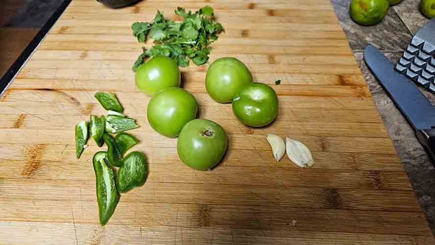 Ingredients tomatillos, cilantro , garlic and jalapeno 