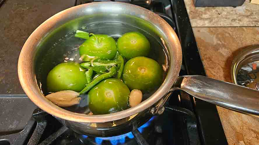 Simmer the tomatillos, jalapeno, and garlic